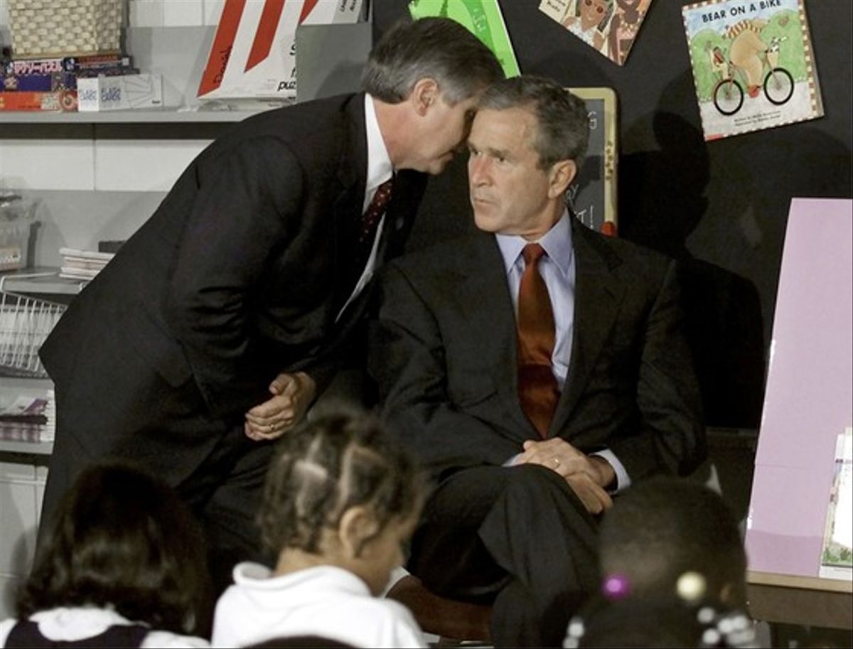 White House chief of staff Andy Card alerts President Bush to the 9/11 attacks