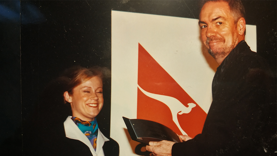 Nevil Gibson collects the Qantas media award award for best weekly newspaper, in the early 2000s