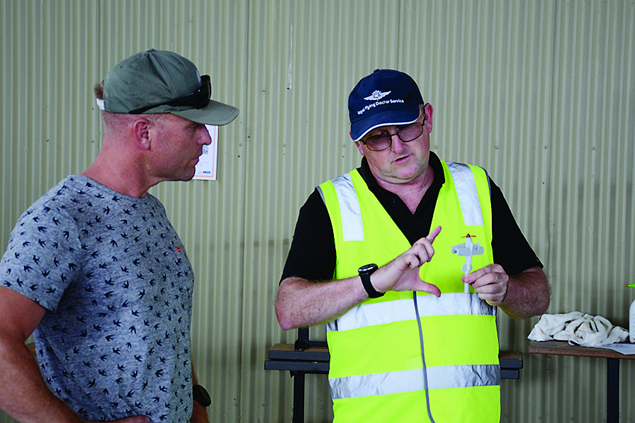 Lloyd Smith, left, is given tips on aerobatics by instructor Tim Marshall, a North Shore Aero Club B category instructor.