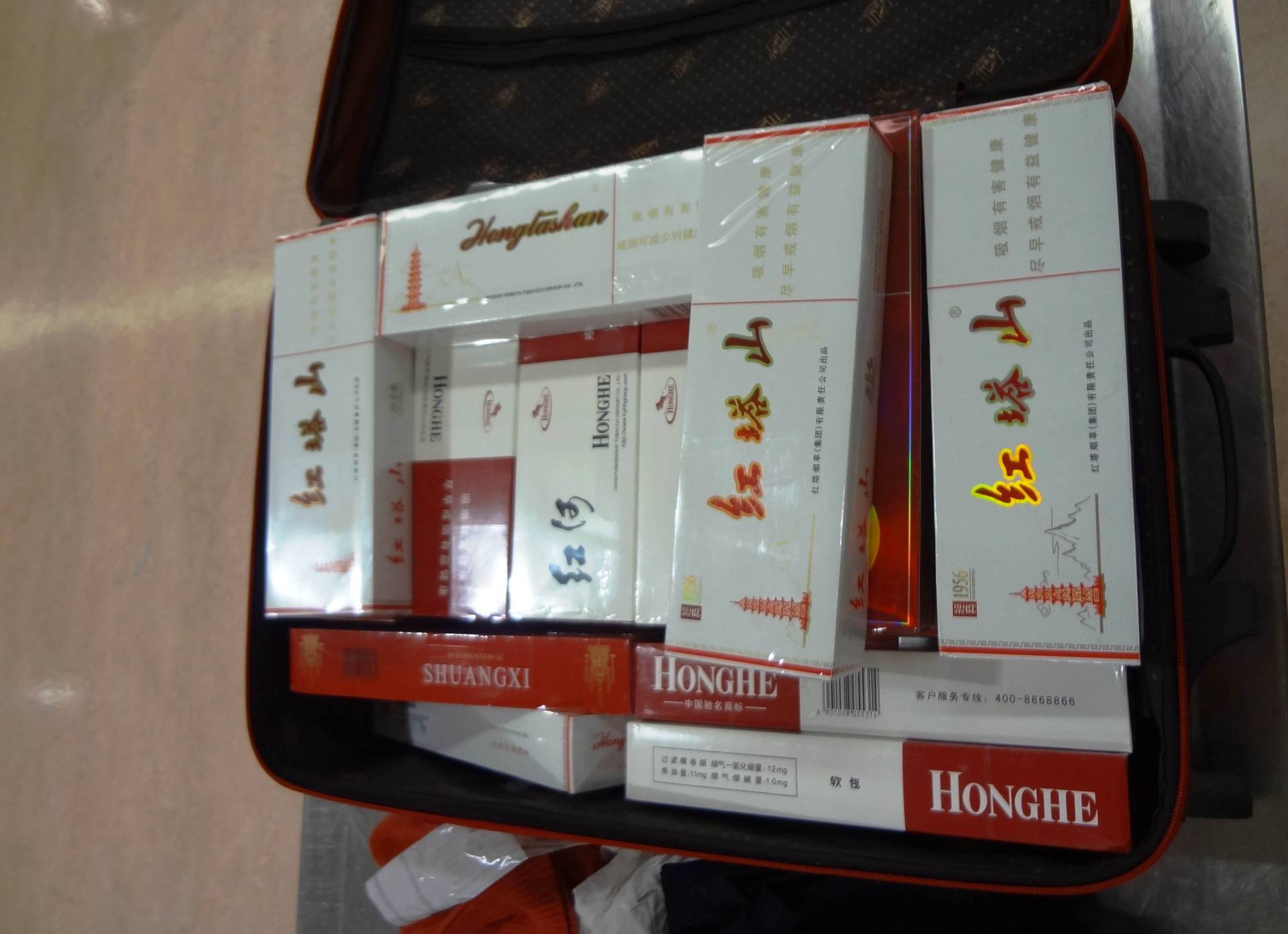 Passenger’s suitcases jampacked with cigarettes